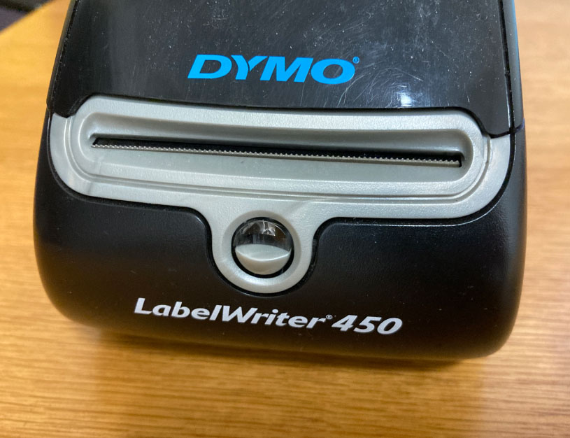 Lift the top of the Dymo 450 to begin the process of clearing the reel 